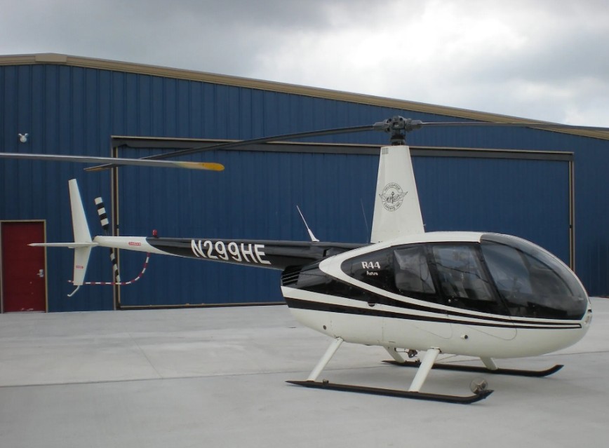 Robinson R-44 Raven four-seat helicopter parked outside the Helicopter Experts hangar in Bulverde, Texas